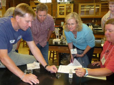 Dr. Jude Apple, SPMC, and community college faculty work on an ocean acidification lab activity